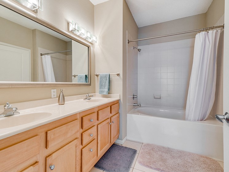 Full bathroom with large mirror and two sinks